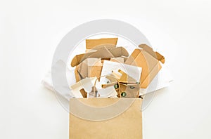 Composition with brown and white paper, prepared for recycling. Reduce, Reuse and Recycle concept. Flat lay