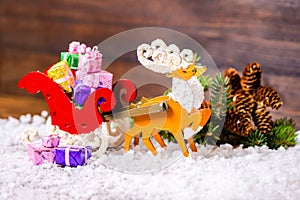 Composition of Christmas decoration reindeer and Santa sleigh wi