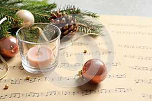 Composition with Christmas decorations and music sheets
