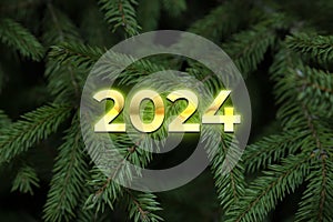 Composition with Christmas tree and number 2024 as a symbol of the coming New Year. Holiday background or greeting card. Top view