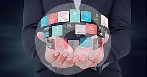 Composition of circle network of digital icons over hand of businessman