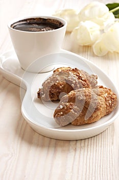 Composition with coffee and croissants