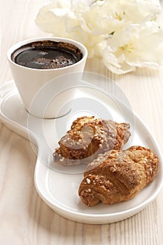 Composition with coffee and croissants