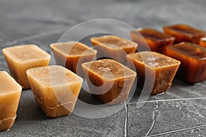 Composition with coffee ice cubes on grey table