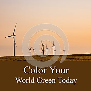 Composition of color your world green today text over wind turbines