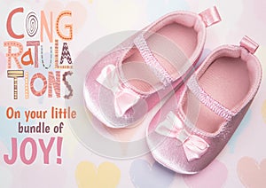 Composition of congratulations on your little bundle of joy with pink baby booties
