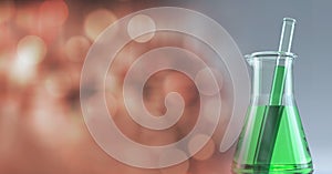 Composition of conical flask of green liquid and stirrer, with blurred copy space