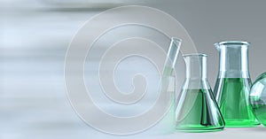 Composition of conical flasks of green liquid and stirrer, with blurred copy space