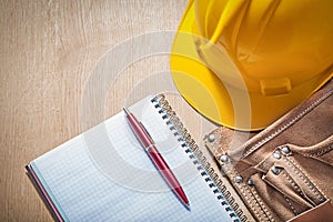 Composition of construction equipment on wooden board