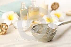 Composition with cosmetic product for spa body wraps on white wooden background