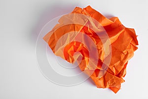 Composition of crumpled sheet of paper placed on a white background