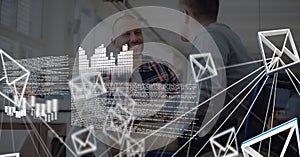 Composition of data processing, network of email icons over two businessmen talking in office