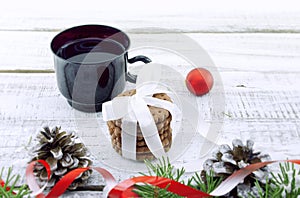 Composition with decorated Christmas tree, cup with coffee and c