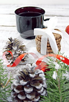 Composition with decorated Christmas tree, cup with coffee and c