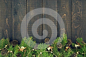 Composition with decorated Christmas tree on dark rustic wooden