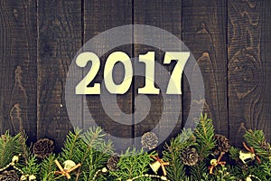 Composition with decorated Christmas tree and number 2017 as a s