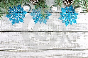 Composition with decorated Christmas tree on white rustic wooden