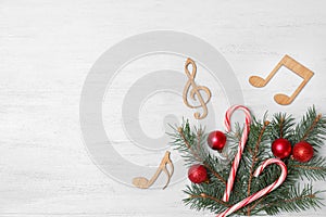 Composition with decorative music notes and space for text on wooden background