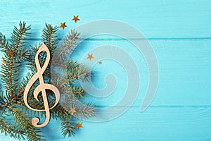 Composition with decorative treble clef and space for text. Christmas music concept