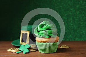 Composition with delicious decorated cupcake on table. St. Patrick`s Day celebration