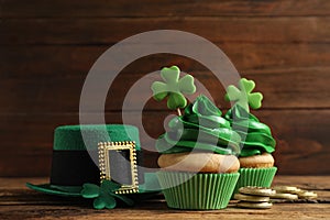 Composition with delicious decorated cupcakes on table. St. Patrick`s Day celebration