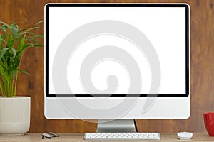 Composition of desktop computer with copy space on wooden background