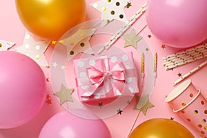 Composition with different birthday accessories on pink background