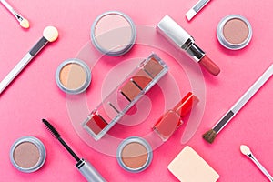 Composition with different makeup products on pink background, top view. beauty products and fashion concept