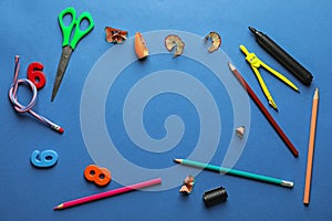 Composition with different school stationery on color background