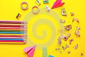 Composition with different school stationery on color background