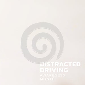 Composition of distracted driving awareness month text over white background