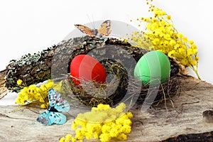 Composition with Easter eggs, butterflies and flowers