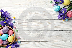 Composition with Easter eggs and Iris flowers on background, space for text