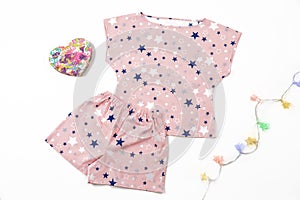 Composition with fashionable pajama in the stars print on white background. gift composition. Valentine`s Day