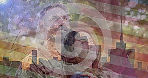 Composition of female soldier embracing smiling wife over american flag