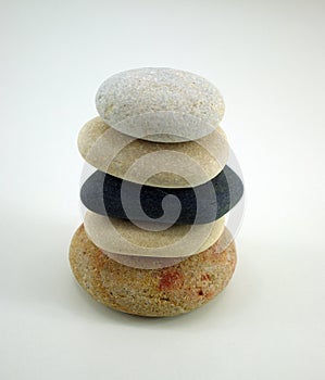 composition with five zen stones on white