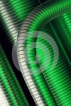 Composition of flexible steel pipes with green reflections