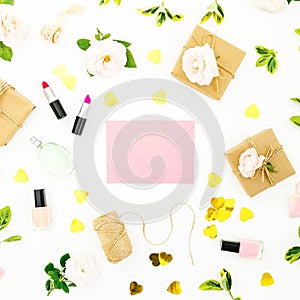 Composition with flowers, pink envelope, cosmetics and gifts boxes on white background. Flat lay, top view. Valentines day concept