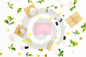 Composition with flowers, pink envelope, cosmetics and gifts on white background. Flat lay, top view. Valentines day concept