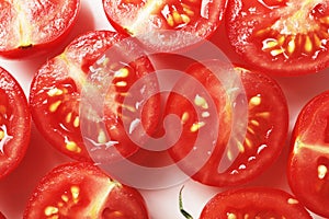 Composition of fresh cherry tomatoes sliced on a ceramic plate. cherry tomatoes, slices of cherry, Composition for design.