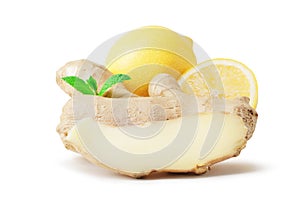 Composition of fresh ginger root, lemon and ginger pieces isolated on white