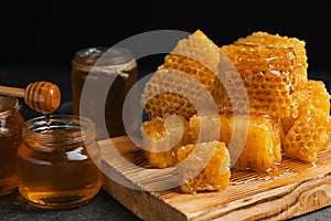 Composition with fresh honey on grey table