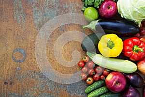 Composition of fruits and vegetables on rustic wooden background