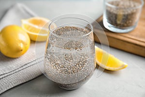 Composition with glass of water, chia seeds and lemon