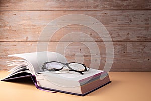 Composition with glasses and book for world philosophy