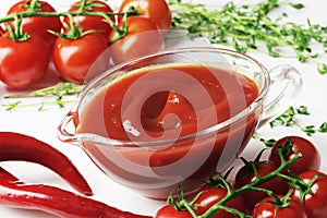 Composition of a gravy boat filled with delicious tomato sauce,