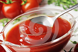 Composition of a gravy boat filled with delicious tomato sauce,