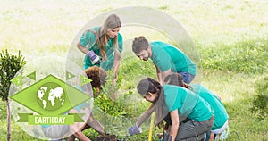 Composition of green globe logo and earth day text over volunteers planting tree in countryside