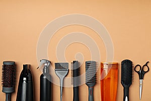 Composition hairdresser accessories on beige background