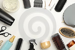Composition hairdresser accessories on white background, space for text
